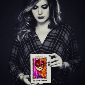 ARZU GENÇOSMAN VE ŞİİR KİTABI BİN GÖLGE BİR AYNA